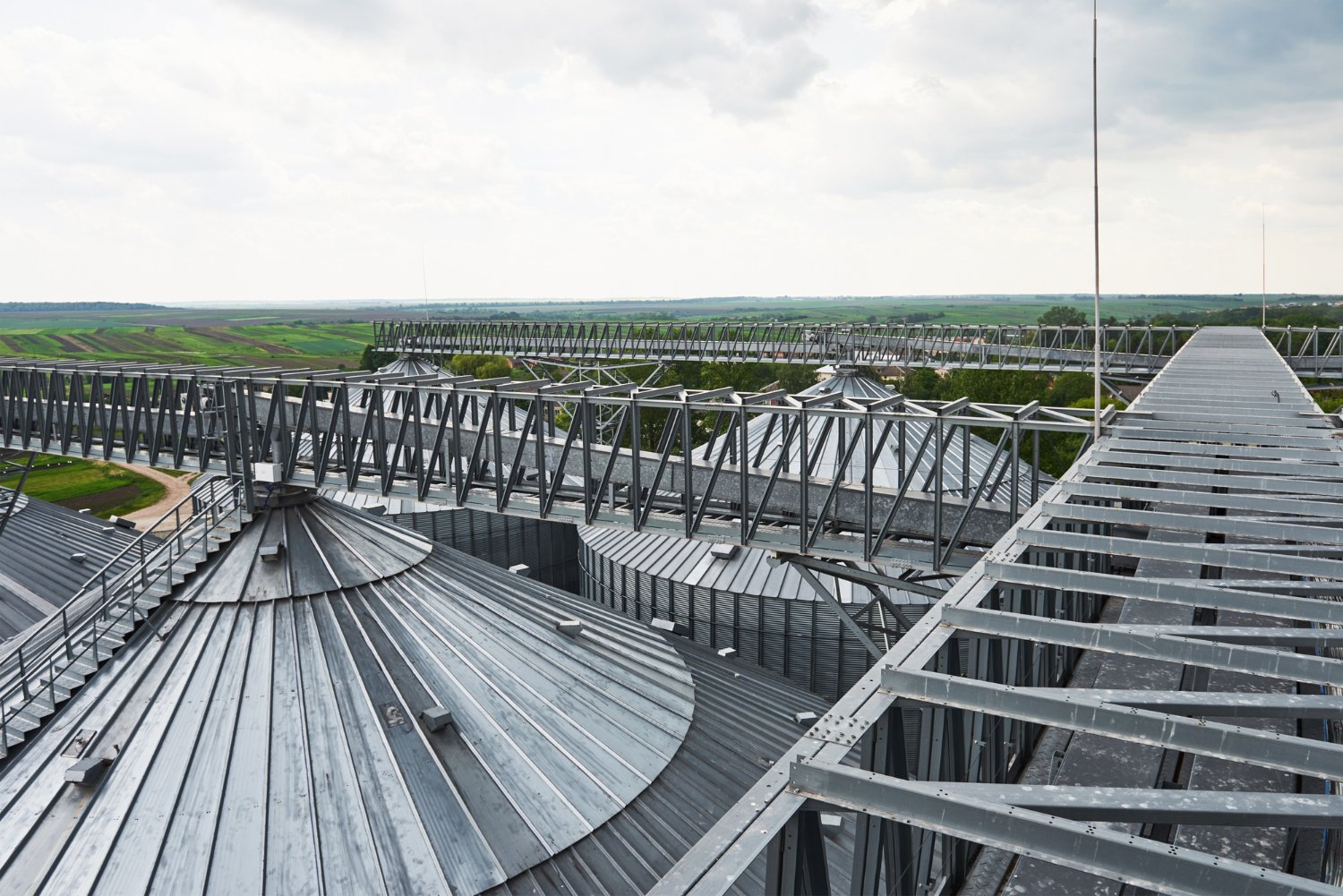 Roof frames, support structures, and walkways for heavy-duty industrial environments